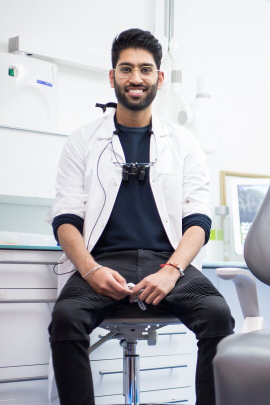 Dr Deepak waiting for an Invisalign consultation patient