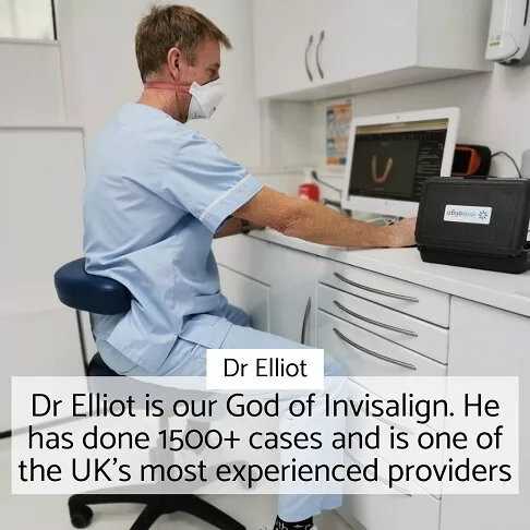 Dr. Elliot, experienced Dentist in Paddington, working on Invisalign cases at a clinic computer station